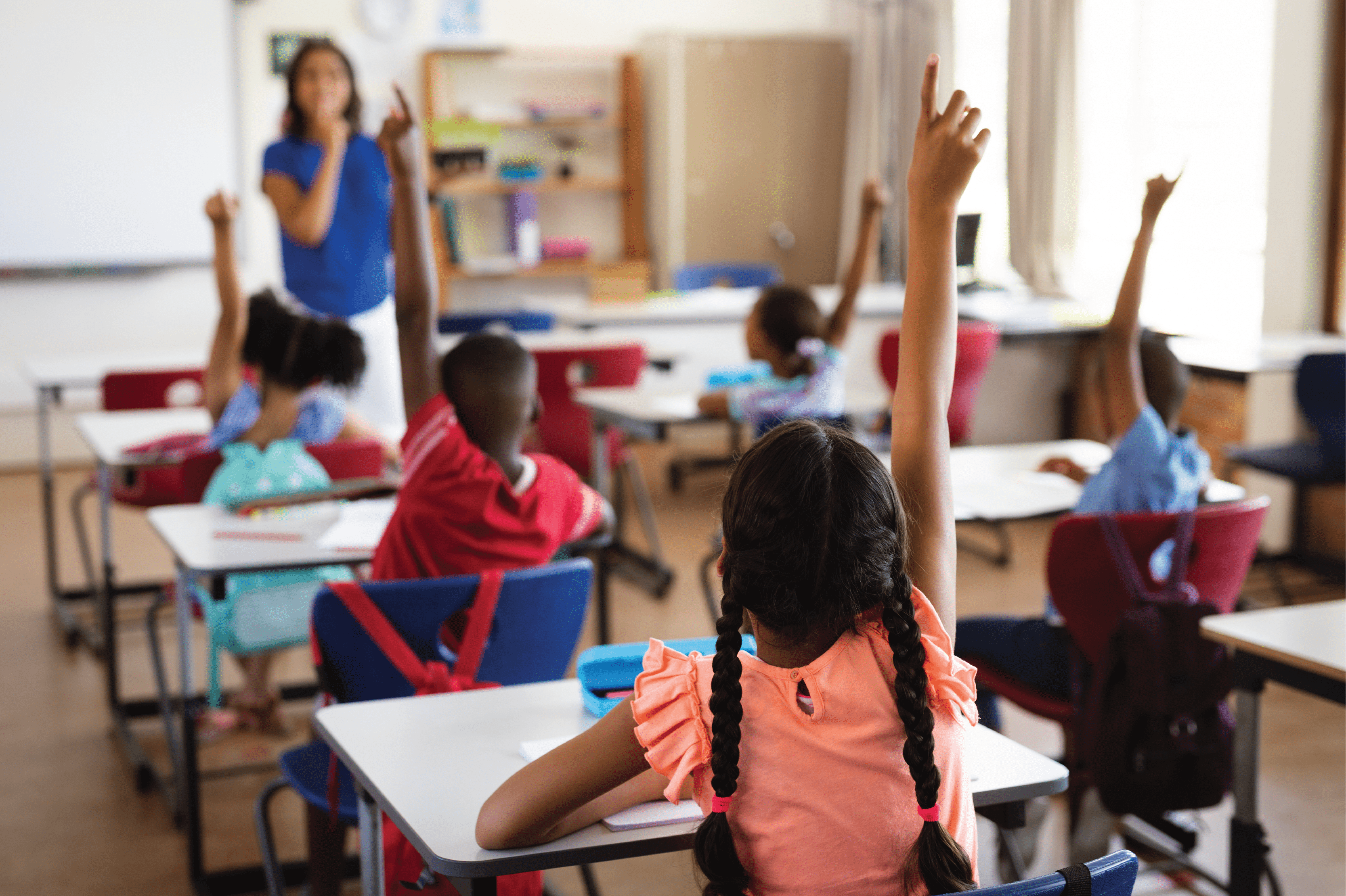 image of students raising hands