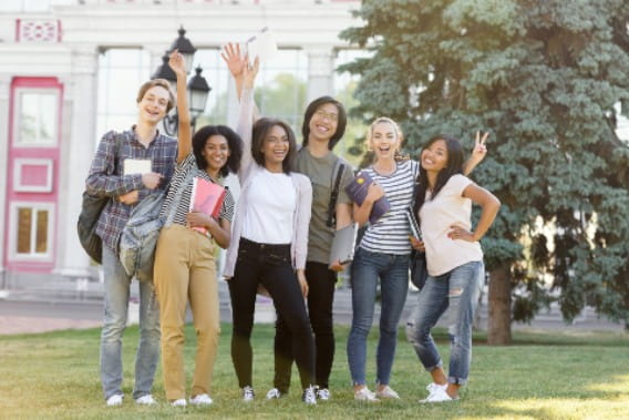 students waving