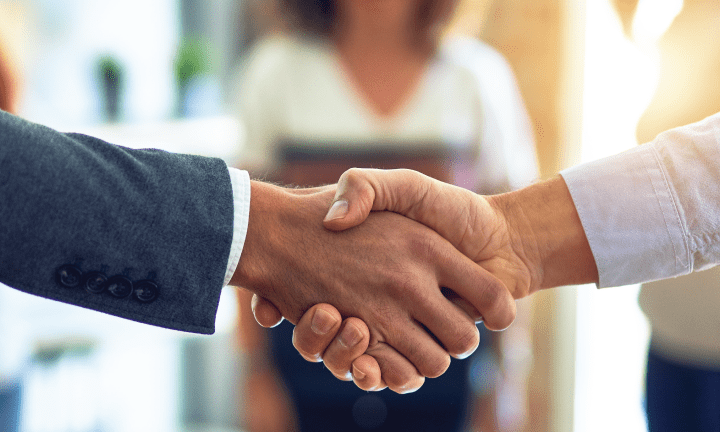 Two men shaking hands.