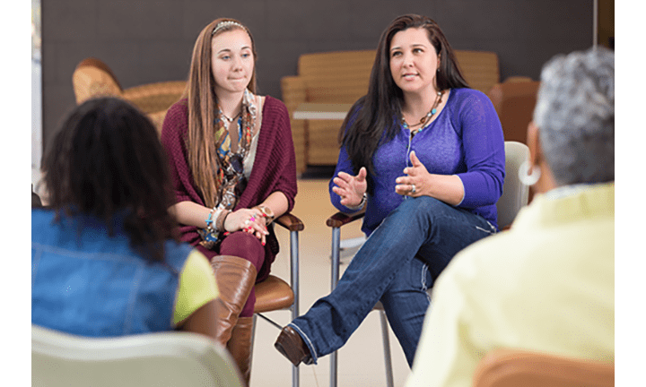 Mother and daughter in group discussion