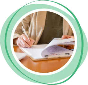 Person writing in notebook