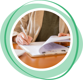 Person writing in notebook