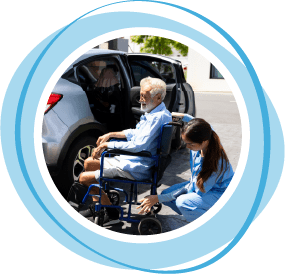 Woman helping elderly man in wheelchair