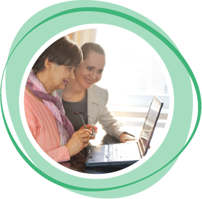 Two women looking at a laptop computer