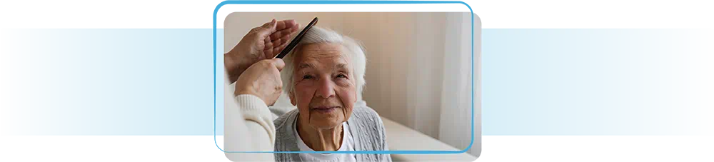 Elderly lady having her hair styled.