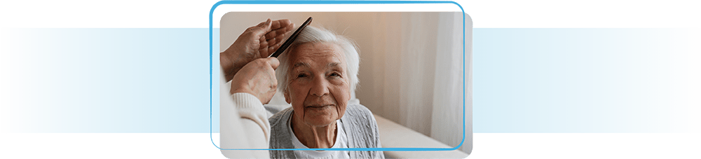 Elderly lady having her hair styled.