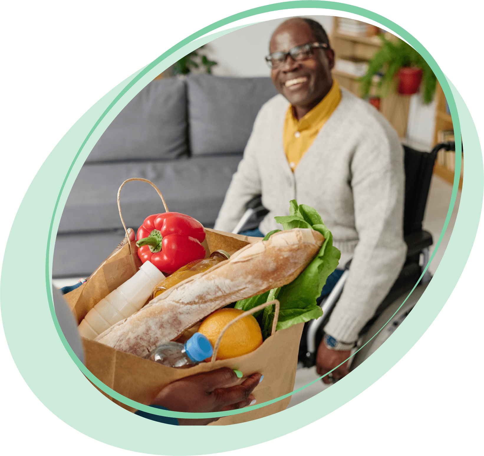 Man in wheelchair with groceries.