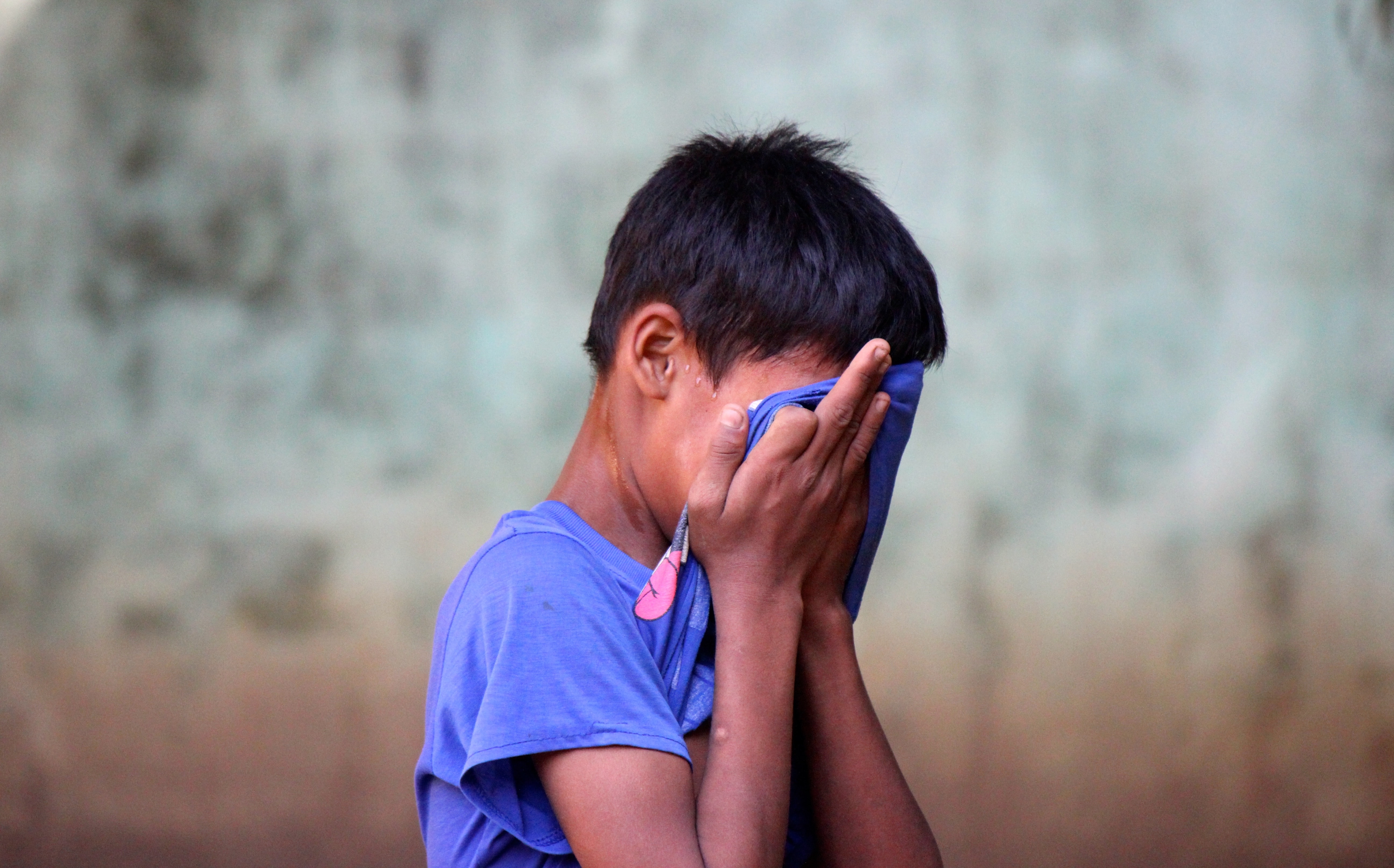 Photo of a boy crying.