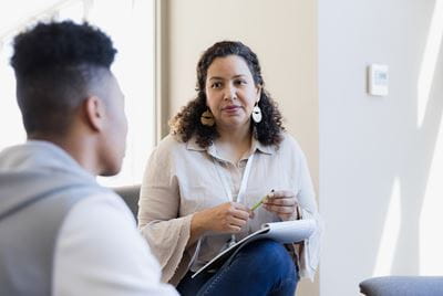 Adolescent talking with therapist