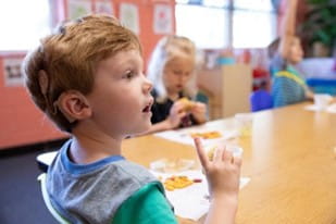 Child with Cochlear Implant hearing device