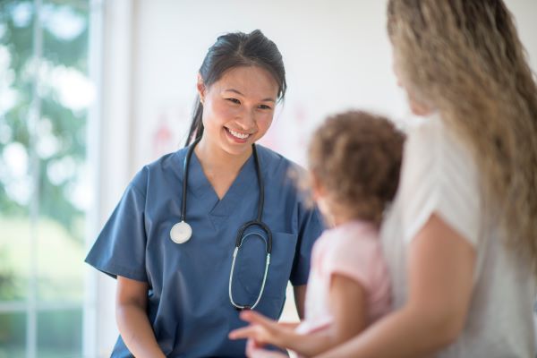 Mom and woman with doctor