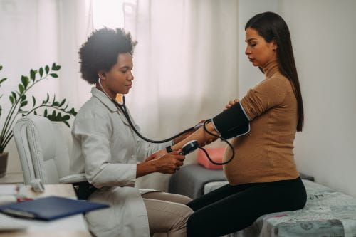 pregnant woman getting blood pressure read