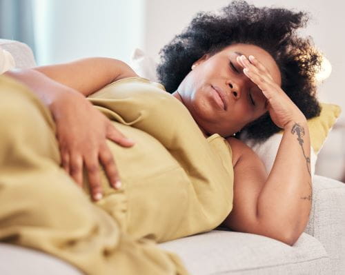 pregnant woman lying on her side