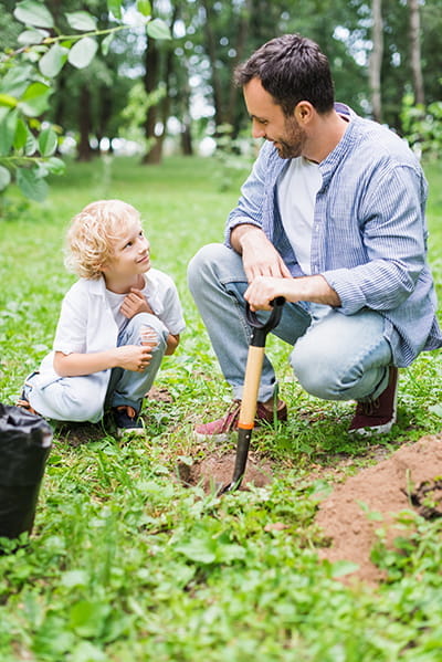 Father & Son Planting Seedlings