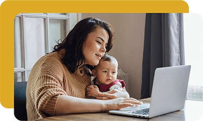 Woman and baby at laptop