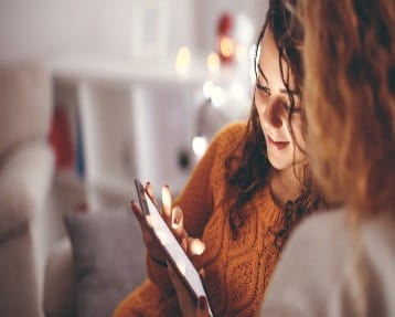 Friends looking at a a digital device