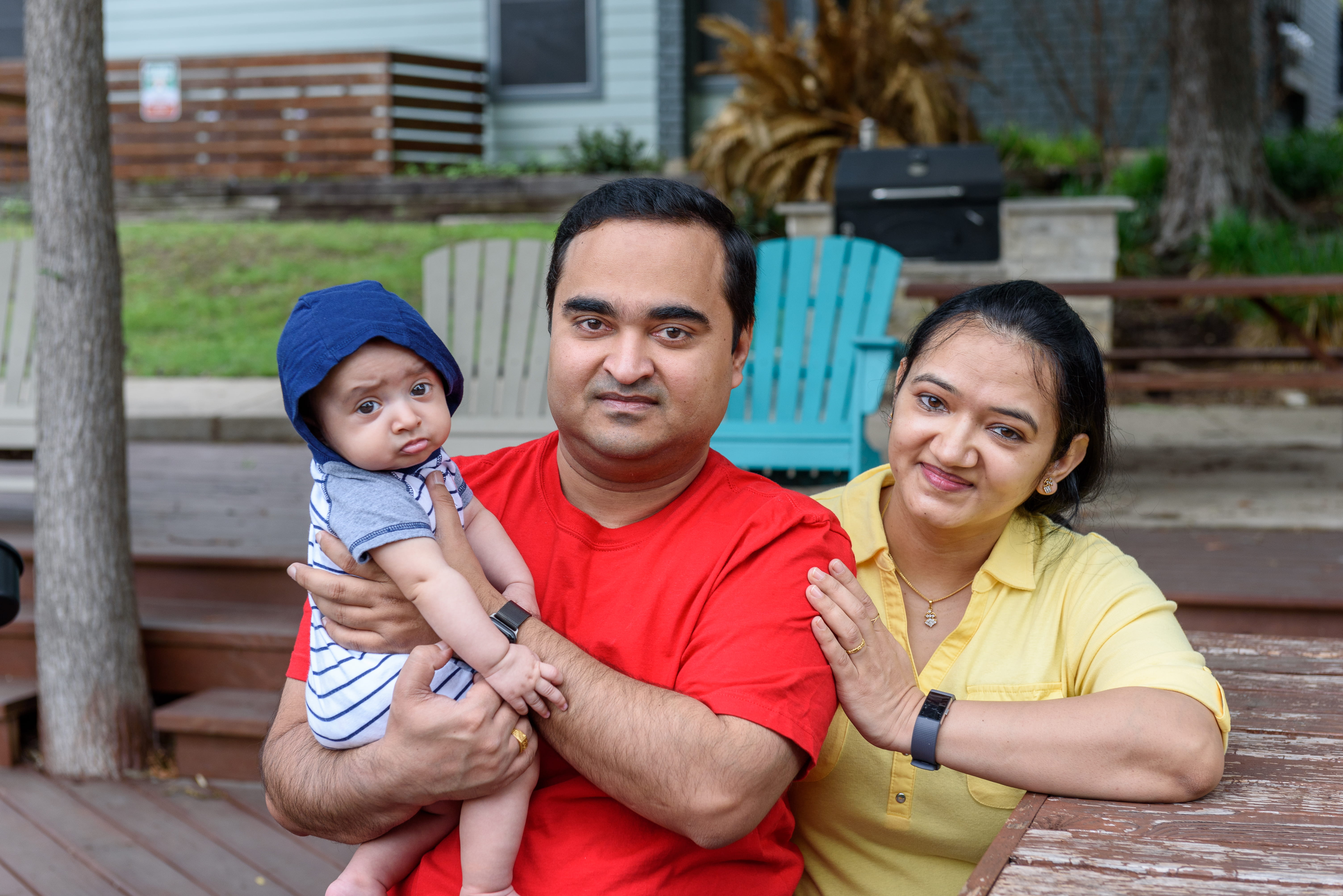 Husband and Wife with Kid in Hat