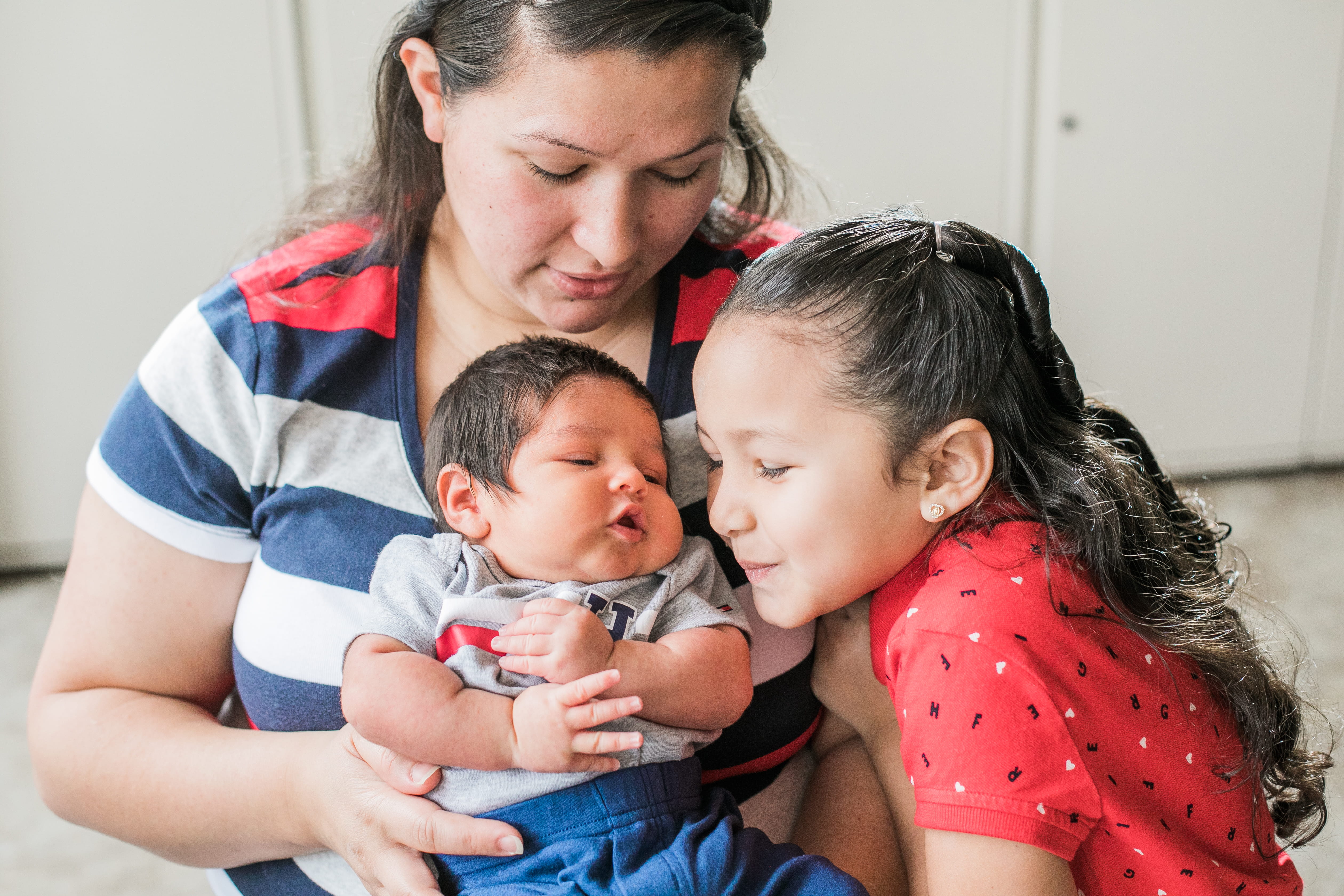 Woman with Daughter and Infant