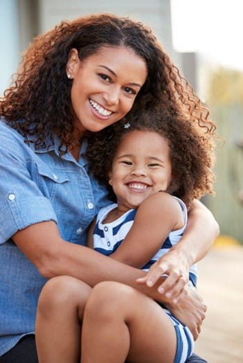 Mother and Daughter Smiling
    