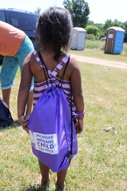 Little Girl with string backpack