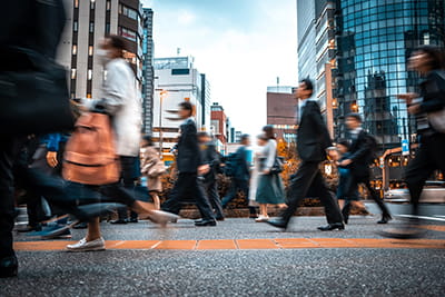 People crossing road in busy city