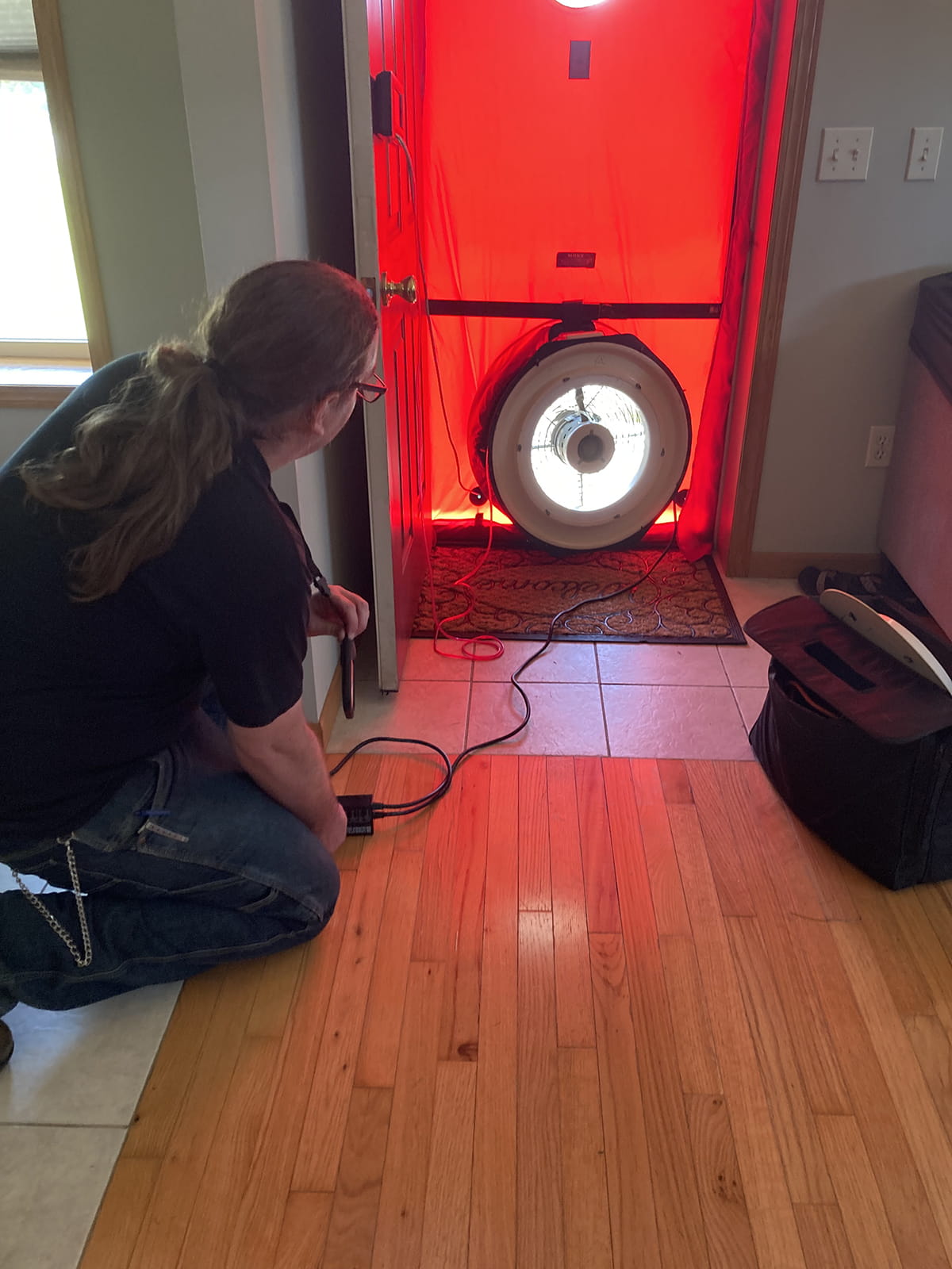 An Energy Auditor using the Blower Door