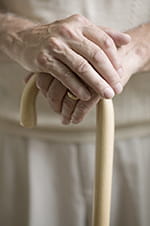 Person holding a walking cane