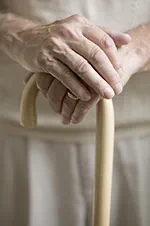 Person holding a walking cane
