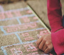 Hand writing in chalk on sidewalk