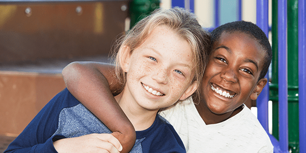 Two kids smiling together