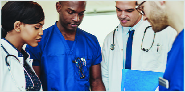 Group of health care professionals conferring