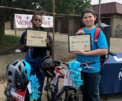 Here are two of the lucky bike winners in River Rouge.