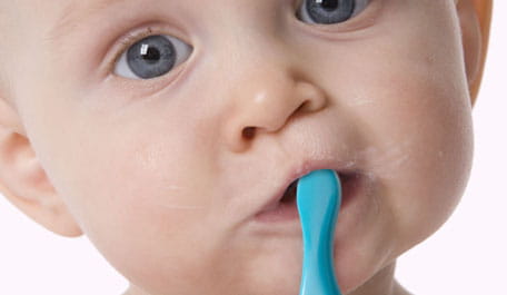 Baby brushing teeth