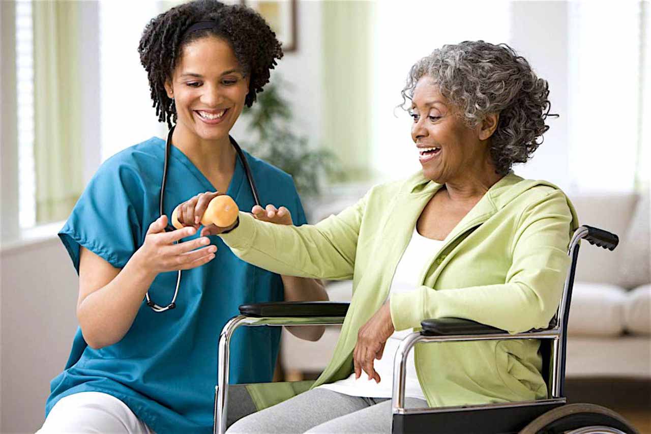 nurse with woman in wheel chair