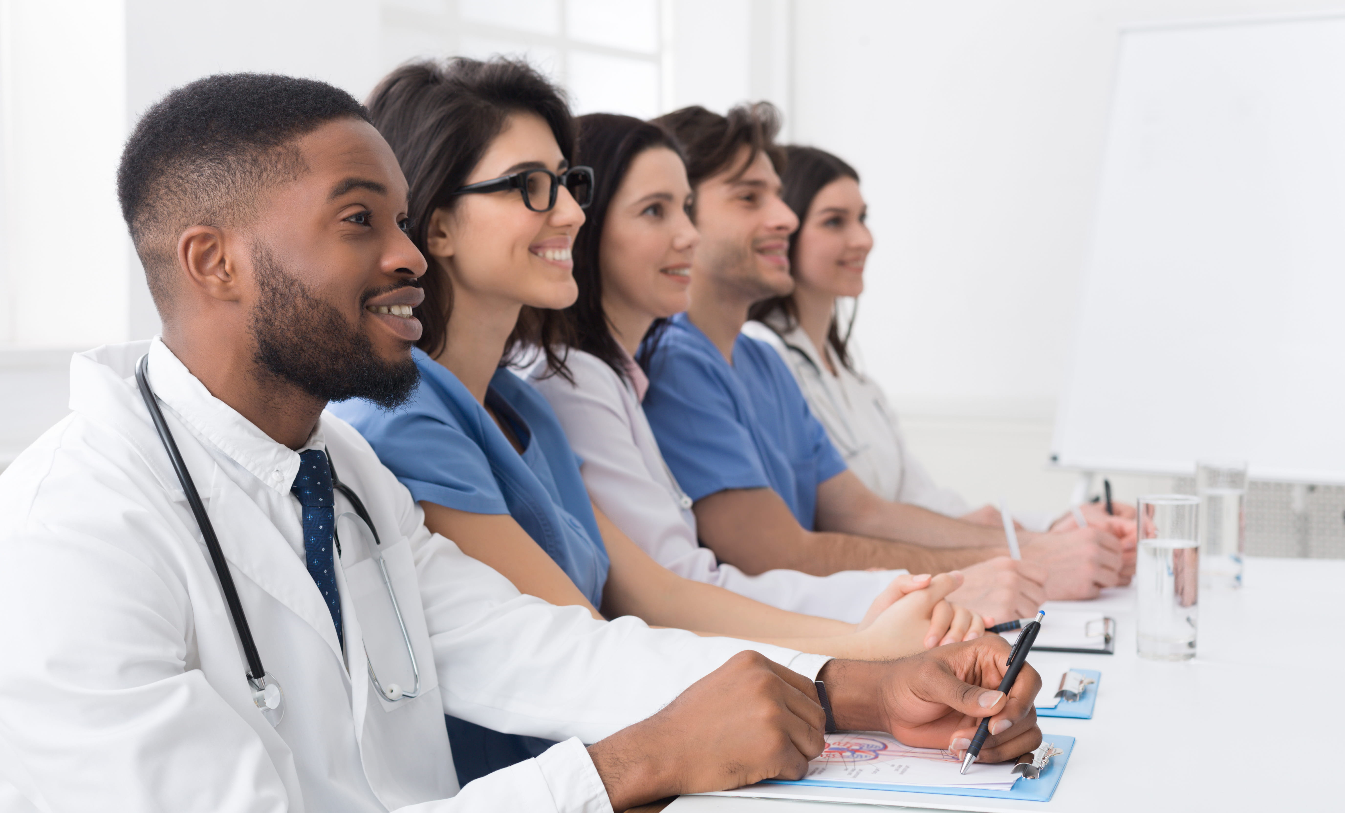 Healthcare Providers Taking Notes

