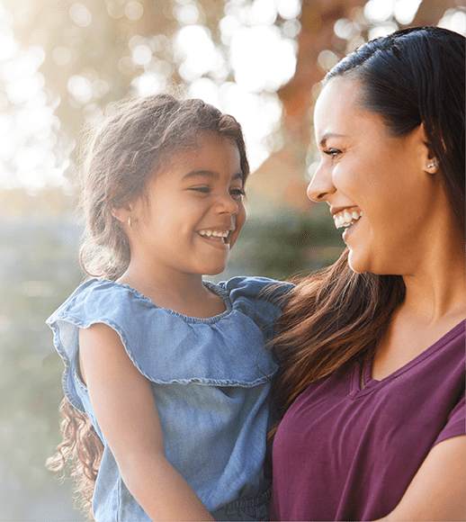 Woman holding young girl