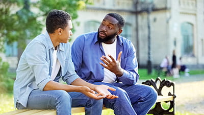 Father talking to son
