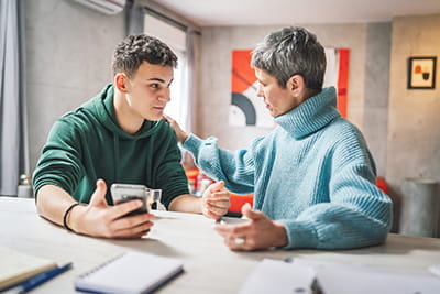 Mother and son talking