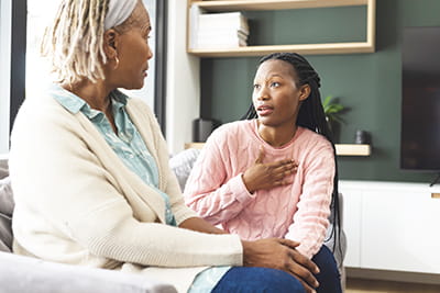 Older and younger woman talking
