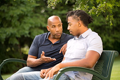 Father and son talking