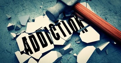 Hammer breaking a tile that says Addiction