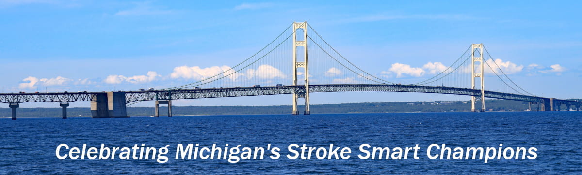 image of Mackinac Bridge stretching across water with words Celebrating Michigan's Stroke Smart Champions below bridge