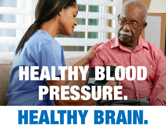 Black nurse taking senior Black gentleman's blood pressure with blood pressure cuff