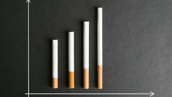 cigarettes of varying lengths, arranged with two axes to look similar to a bar graph