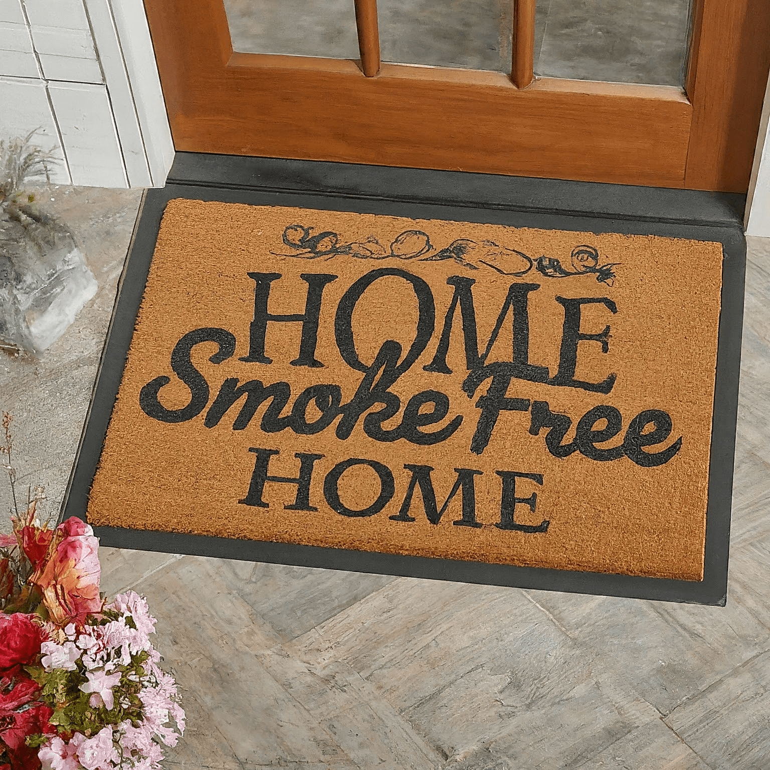 medium-brown doormat with "Home Smoke-Free Home" in black
