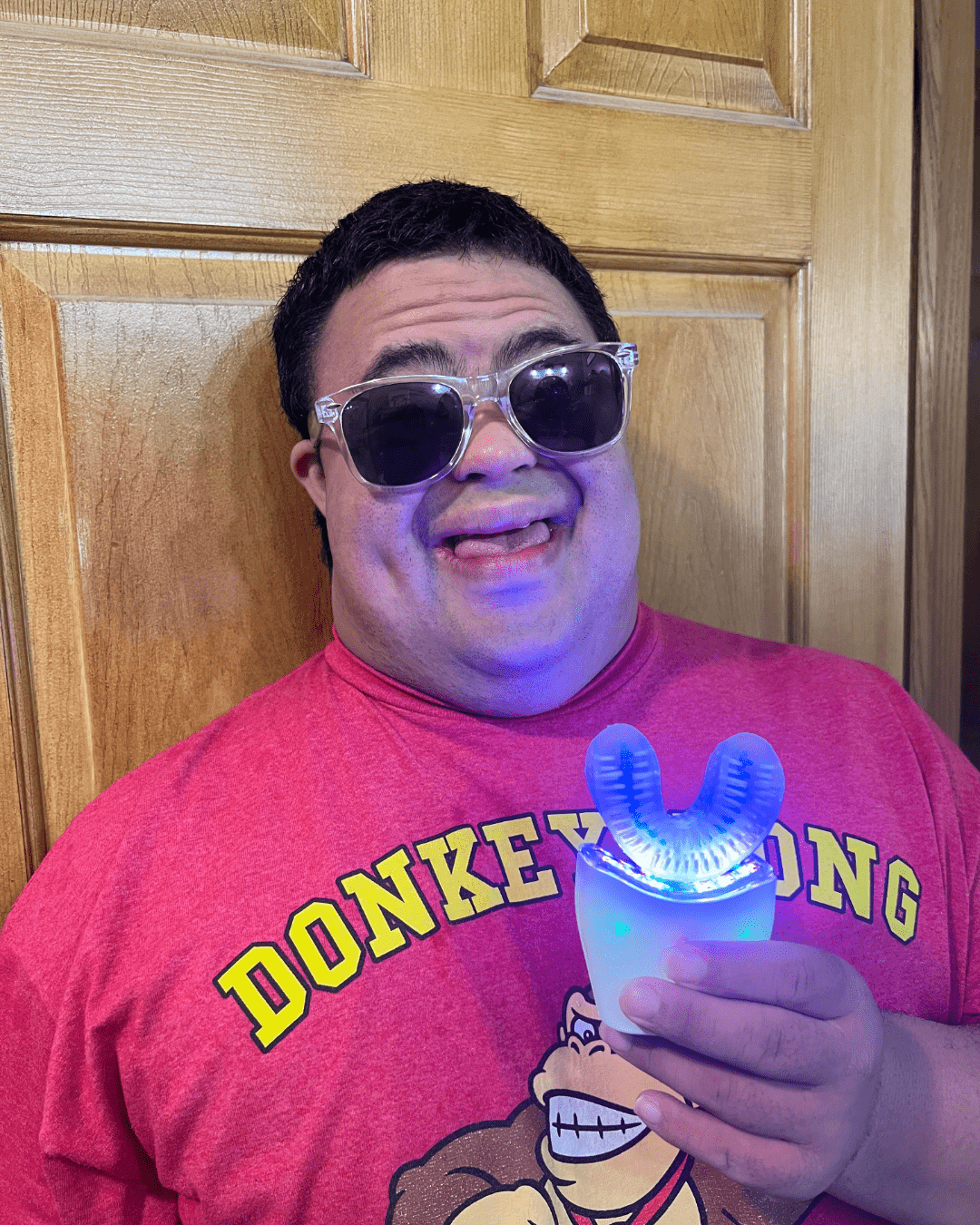 A photo of Logan holding hus autobrush