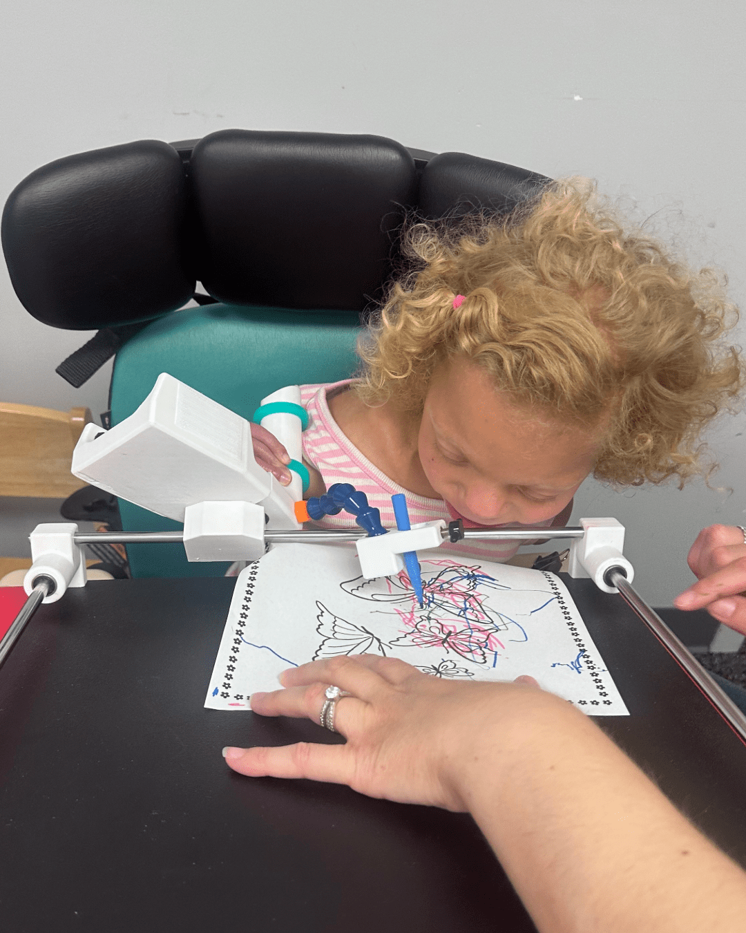 A photo of Natalie using her AT device during an AT demonstration with MATP