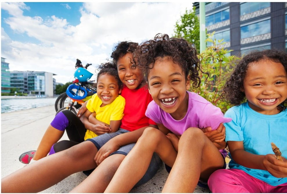 photo of seated smiling children