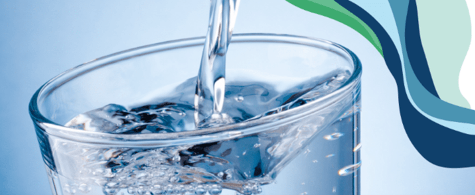 Close-up shot of glass filling with water with a stylized background