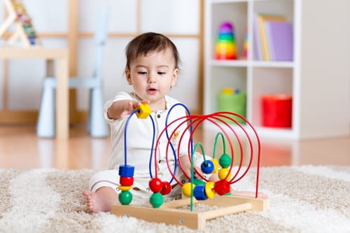 Baby playing with toy